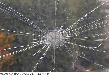 Damage To Plexiglass From A Strong Impact. Street Fencing.