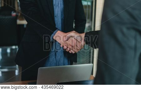 Businessman Handshake For Teamwork Of Business Merger And Acquisition, Successful Negotiate, Hand Sh