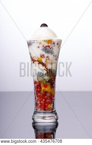 Mixed Fruit Ice Cream Or Falooda Arranged In Grey Background.