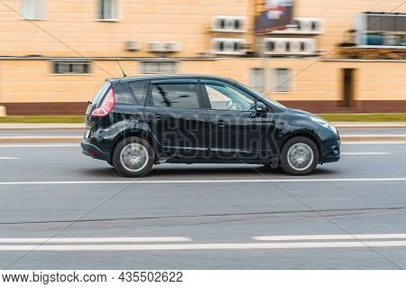 Renault Scenic Third Generation Facelift In Motion On The City Street. 5-door Minivan Driving On The