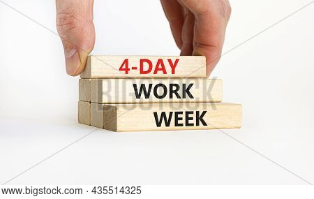 4-day Work Week Symbol. Concept Words '4-day Work Week' On Wooden Blocks. Businessman Hand. Beautifu