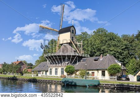 Historic Wooden Windmill Along The River Vecht In The City Of Weesp In The Netherlands