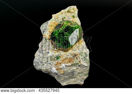 Macro Mineral Stone Andradite On A Black Background Close-up