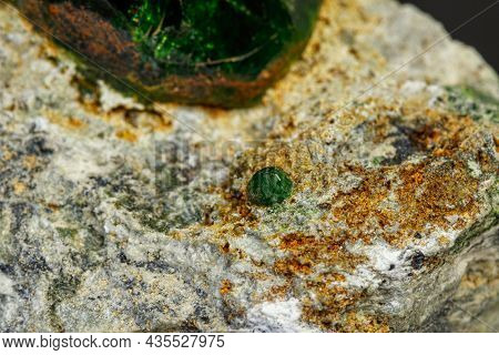 Macro Mineral Stone Andradite On A Black Background Close-up