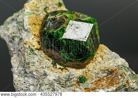 Macro Mineral Stone Andradite On A Black Background Close-up