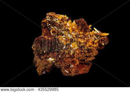 Macro Mineral Wulfenite Stone On A Black Background Close-up