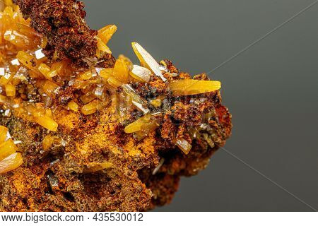 Macro Mineral Wulfenite Stone On A Black Background Close-up