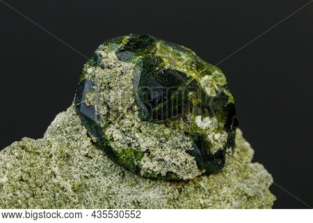 Macro Mineral Stone Andradite On A Black Background Close-up