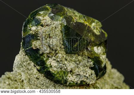 Macro Mineral Stone Andradite On A Black Background Close-up
