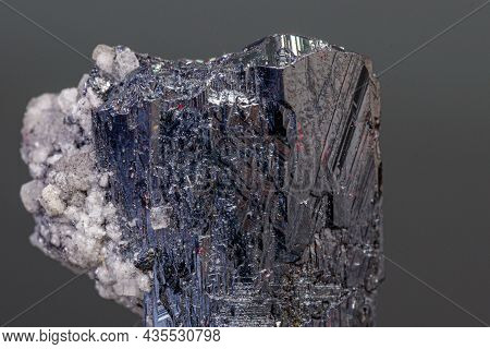 Macro Mineral Acanthite Stone On A Black Background Close-up