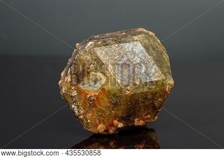 Macro Mineral Stone Andradite On A Black Background Close-up