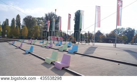 Kreuzlingen, Switzerland - 14 Oct 2015: Kreuzlingen Harbour Promenade With Colourful Seats And A Vie