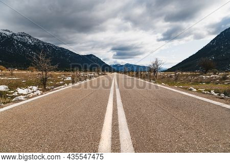 Empty Asphalt Road In The Middle Of Mountainous Area. Highlands Of Greece, Winter Time. Freedom, Tra