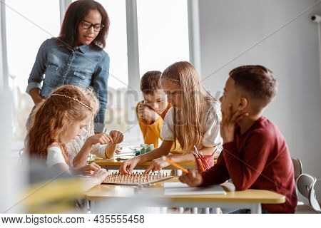 Kids Training Analytical And Creative Skills In Classroom