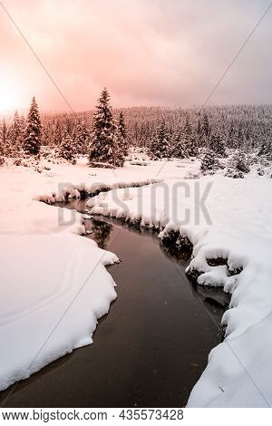 Winter In Jizera Mountains. Snowy Landscape With Trees And Small Creek. Czech Republic