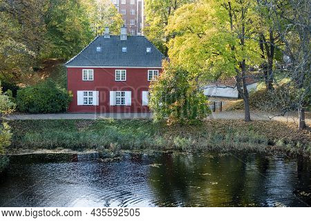 Copenhagen, Denmark - Oct 22, 2018: Charming Red Cottage Viewed From The Star-shaped 17th Century Ka