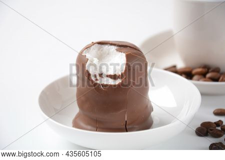 White Chocolate Krembo On The Table. A Chocolate-coated Marshmallow Treat That Is Popular In Israel.