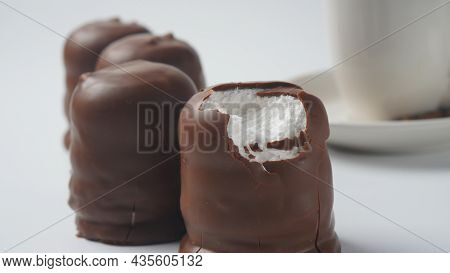 White Chocolate Krembo On The Table. A Chocolate-coated Marshmallow Treat That Is Popular In Israel.