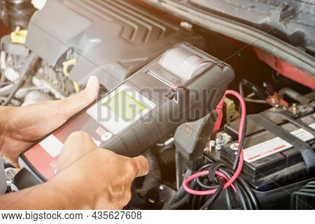 Mechanic Use Voltmeter Checking Voltage Of Car Battery In Car Service Centre