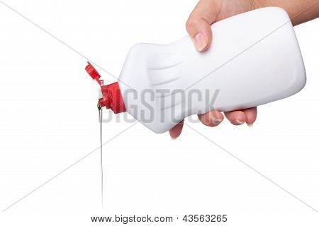 Hand with a detergent plastic bottle isolated on white background