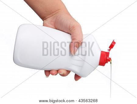 Hand with a detergent plastic bottle isolated on white background