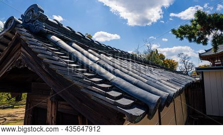 Beautiful Rooftop House At Traditional Garden Under Green Trees. Roof Of Japan