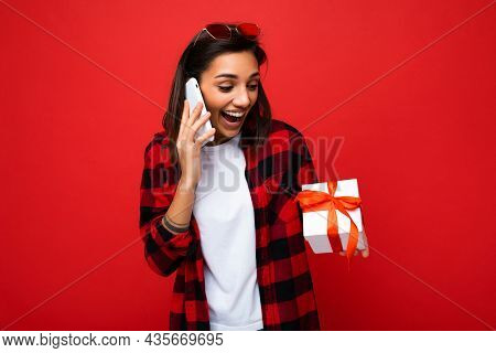 Photo Shot Of Pretty Positive Surprised Young Brunet Woman Isolated Over Colourful Background Wall W