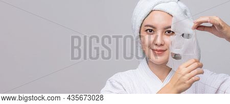 Asian Woman Pulling Away Mask From Her Face On Banner With Copy Space. Treatment Hyperpigmentation A