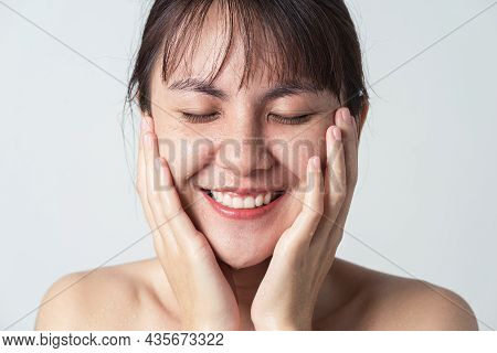 Freshness Smiling Of Young Asian Female With Water Drop On Her Face. Close Up Face Asian Woman Washi