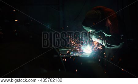 Welder At Work. Ndustrial Welder With Torch. Industrial Worker Welding Steel.