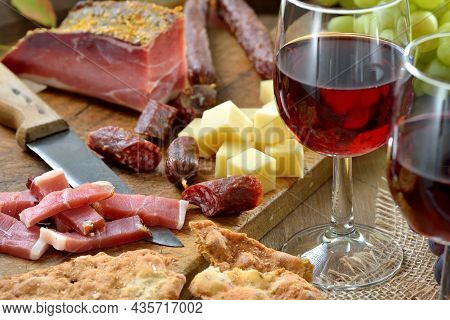 Hearty Snack In South Tyrol With The Typical Bacon, Salami, Mountain Cheese And The Very Crunchy Fla