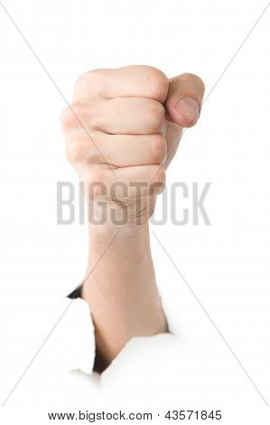 Human showing fist through the paper