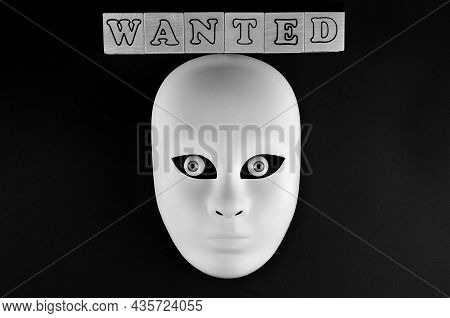 Financial Fraud Crime. The White Mask Of A Fraudster. The Inscription Is Wanted.