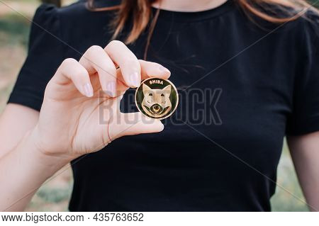 Empuriabrava, Spain, June 2021 - Woman Holding One Shiba Token, Coin With Shiba Symbol, Concept Of I