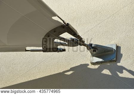 White Tarpaulin Taut, Shading From The Sun And Rain Over The Terrace Of The Restaurant, On The Playg