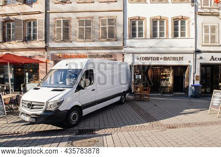 Strasbourg, France - Feb 16, 2019: White Mercedes-benz Sprinter Van Unloading Merchandise Goods In F