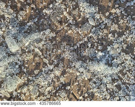 Pieces Of Broken Tempered Glass Lying On Paving Slabs Closeup Background