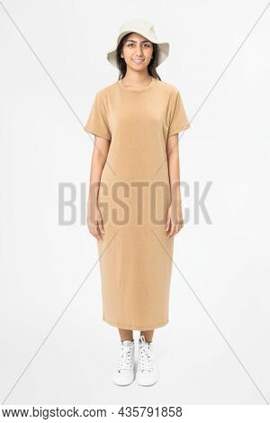 Woman in beige t-shirt dress and bucket hat casual wear apparel