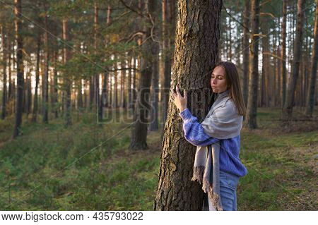 Love And Unity With Nature: Young Calm Woman Hugging Tree Trunk With Closed Eyes. Spiritual Female O