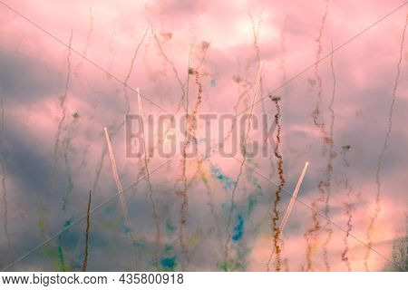 Flying Fireworks In The Night Sky. Line Trackrs Create A Pattern Of A Cage. Head Of The Comet And It