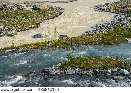 Sunny Alpine Landscape With Confluence Of Two Various Mountain Rivers. Beautiful Clear Creek Flows I