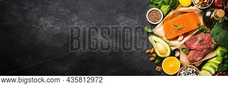 Keto Diet Food. Healthy Food Products At Black Background. Salmon Steak, Beef, Beans, Nuts, Vegetabl