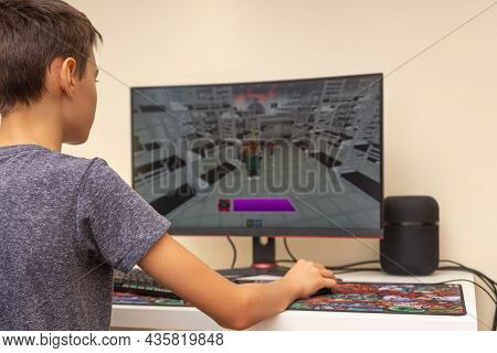 Vilnius, Lithuania - October 09, 2021: Teenager Playing Video Game Squid Game On Computer At Home. S