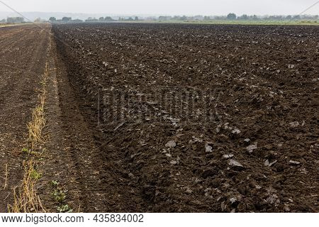 Freshly Plowed Soil Field In The Foggy Morning - Close Wide Angle View With Edge-to-edge Sharpness, 