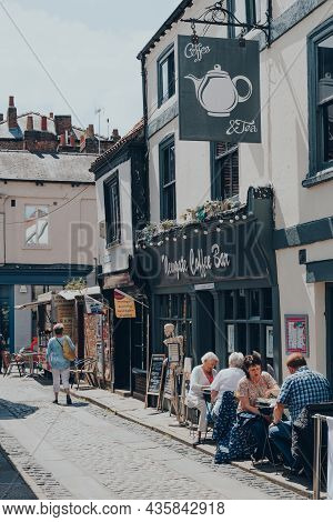 York, Uk - June 22, 2021: People At The Outdoor Tables Of A Newgate Coffee Bar On A Narrow Street In