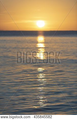 Beautiful Sunrise Over Pentewan Sands In Cornwall With Pastel Sky And Long Exposure Ocean