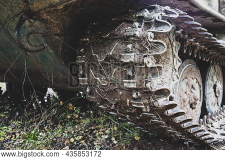 Tracked Vehicles. Dirty Caterpillar Of An All-terrain Vehicle Close-up. Off-road And Military Vehicl