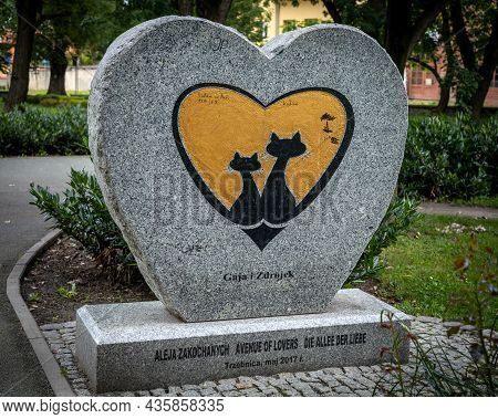 Trzebnica, Poland - August 29, 2021: A Heart-shaped Stone Monument Of A Cat Couple 