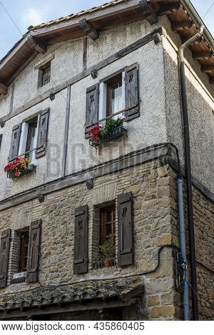 Facade of a medieval building in the center of Pamplona, ??medieval stone streets, typical and tourist alley of the city. Navarra Spain