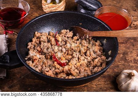 Sausage, Onion And Pepper Ragout - Sausage Ragout In A Pan On The Table With Ingredients For Making 